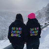 two girls skiing in black classic Hangover Hoodies